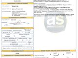 a document with a picture of a car on it and a barcode on it