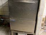 an image of a dirty kitchen with a dishwasher in the corner