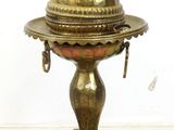 an antique brass plate with a dome on top of it