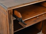 a small wooden cabinet with a drawer on top of it