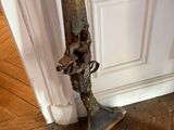 a pair of skis sitting on the floor next to a door