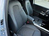 the interior of a car with two black seats and a steering wheel