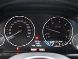 a close up of a car dashboard with various gauges