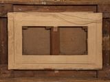 an old picture of a picture frame with a cross on it