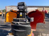 an image of a forklift sitting in a parking lot