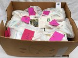 a cardboard box filled with lots of items that have been wrapped in plastic
