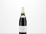 a bottle of red wine sitting on top of a table