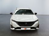 the front view of a white car in a white room