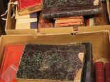 a box full of books sitting on the floor