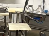a kitchen with a lot of tables and chairs in it