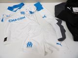 a white and blue shirt and shorts on a table