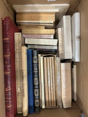 a box full of books that are sitting on the floor
