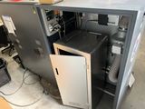 a machine that is sitting inside of a metal cabinet