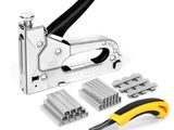 a stapler, cutter, and other tools on a white background