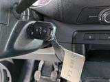 a car dashboard with a car key attached to it