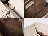the inside of a white purse with a zipper on it