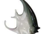 a glass sculpture of a fish on a white background
