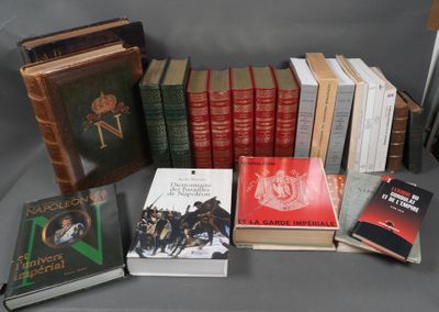 several books are stacked on top of each other on a table