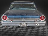 a old car that is sitting on a checkered floor