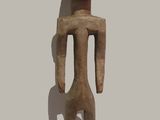an image of a wooden sculpture of a man with a bald head