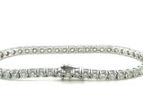 a diamond tennis bracelet with a clasp on a white background