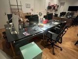 an image of a room with a lot of desks and computers