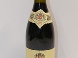 a bottle of wine that is sitting on a table