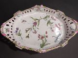 a white plate with flowers on it on a table