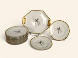 a group of plates with birds on them on a white surface