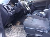 a picture of the inside of a car with the front seats down