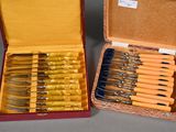 a lot of knives that are in a case