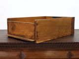 a wooden box sitting on top of a dresser