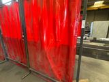 red plastic sheeting on a metal frame in a warehouse