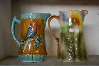 two vases that are sitting on a shelf