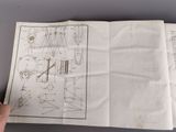 someone is holding a piece of paper with a drawing on it
