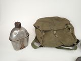 a bag and a canteen on a white table