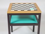 a small table with a chess board on top of it