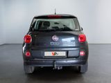 a small black car that is parked in a room