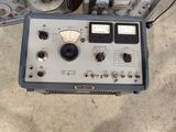 a machine that is sitting on the ground next to other equipment