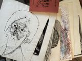 a lot of drawings on a piece of paper on a table