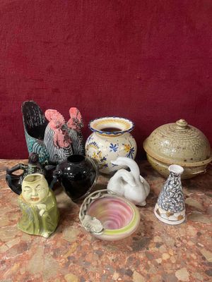 many different types of ceramic figurines sitting on a table