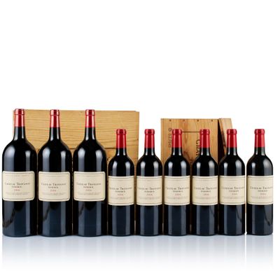 a group of bottles of wine sitting next to each other