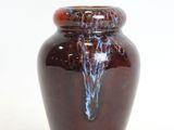 a brown vase with a blue and red design on it