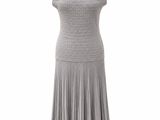 a dress on a mannequin stand with a white background