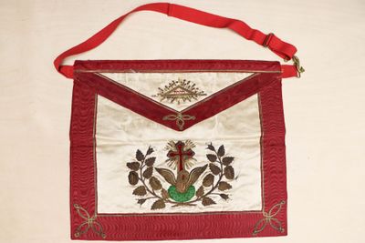 a red and white bag with a bird on it