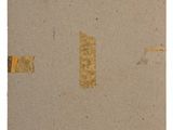 an image of a piece of brown paper with a sticker on it
