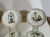 two plates that are sitting on top of a glass table