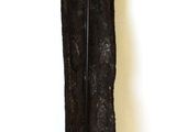 a tall piece of black fur on the floor