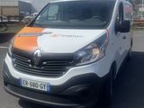 a white van with an orange and white stripe parked in a parking lot
