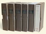 five books that are stacked on top of each other
